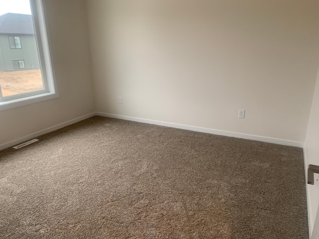 view of carpeted spare room