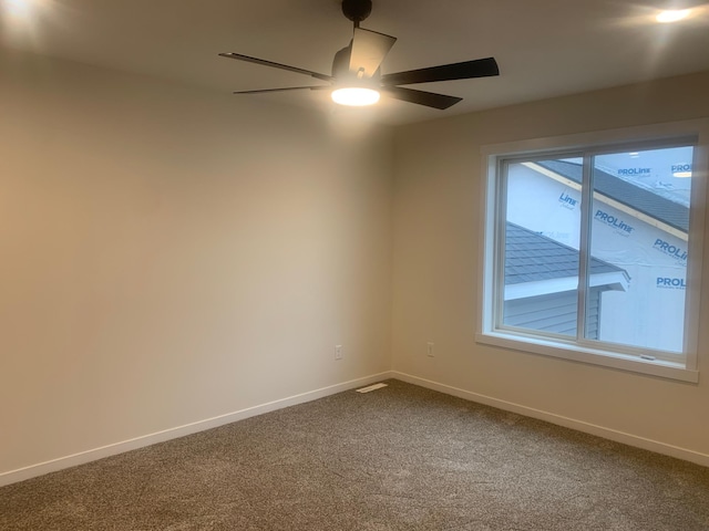 carpeted empty room with ceiling fan