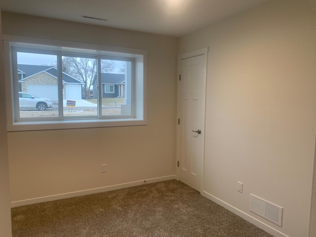 view of carpeted spare room