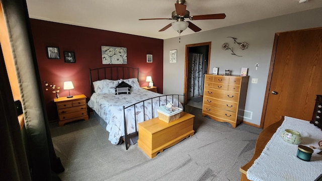 carpeted bedroom with ceiling fan