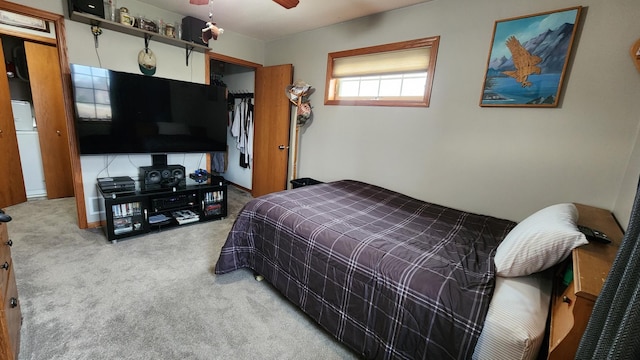 carpeted bedroom with a closet and ceiling fan