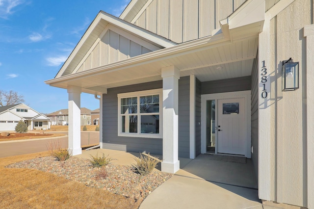 doorway to property featuring covered porch