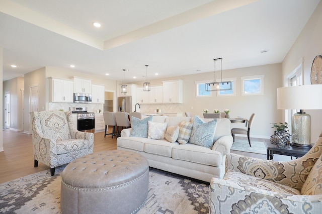 living room with light hardwood / wood-style flooring