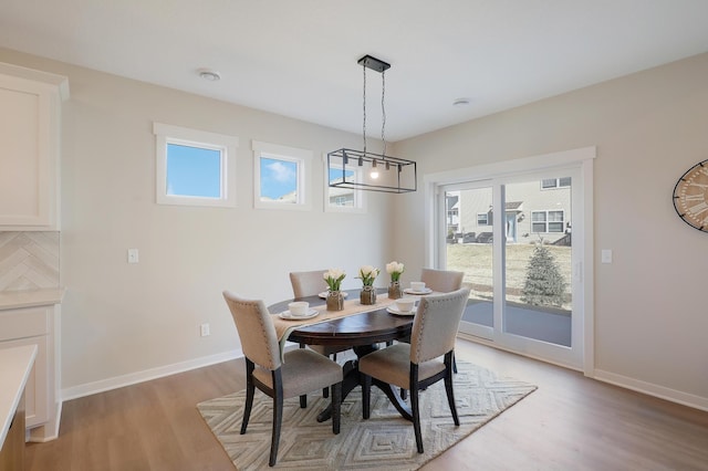 dining room with light wood-type flooring