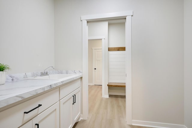 bathroom featuring vanity and wood-type flooring