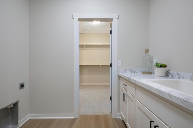 bathroom with vanity and hardwood / wood-style flooring