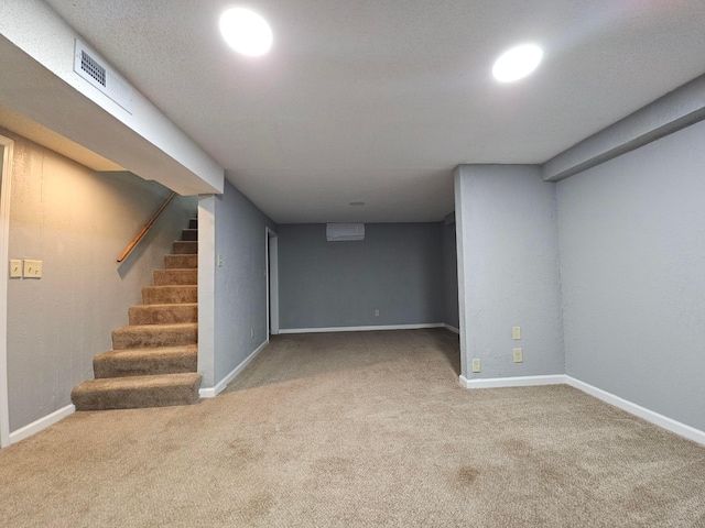 basement featuring light carpet