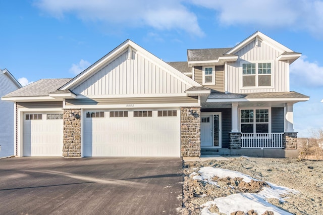 craftsman-style home with a porch and a garage