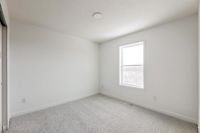 empty room featuring carpet