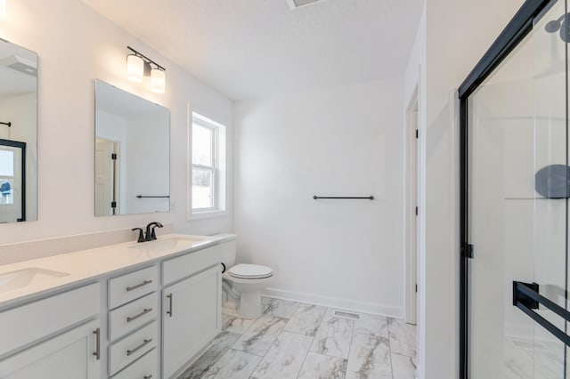 bathroom with toilet and vanity