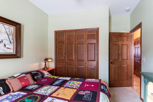 carpeted bedroom featuring a closet