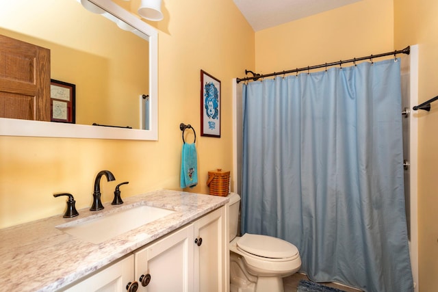 bathroom with toilet, curtained shower, and vanity