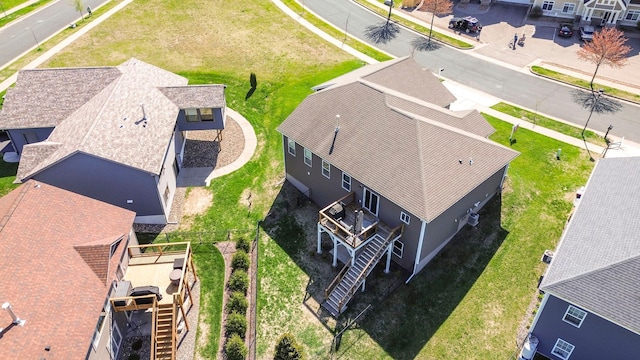 birds eye view of property with a residential view