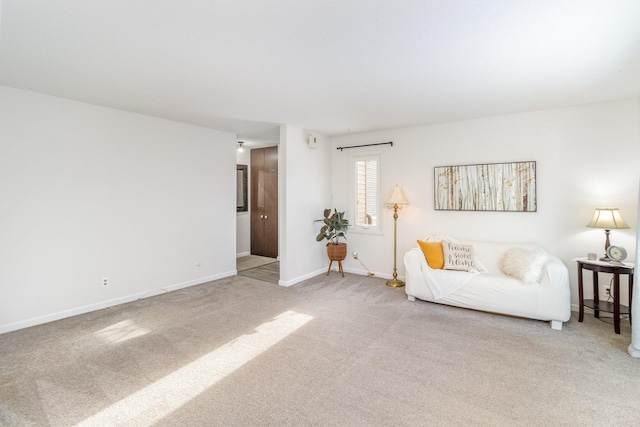 unfurnished living room with light colored carpet