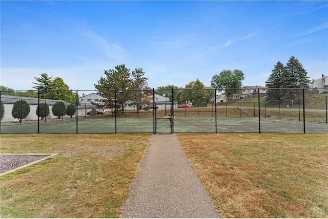 view of basketball court featuring a yard