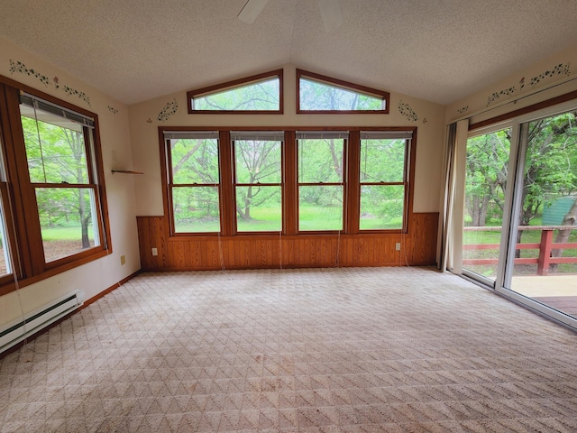 unfurnished sunroom featuring a baseboard heating unit