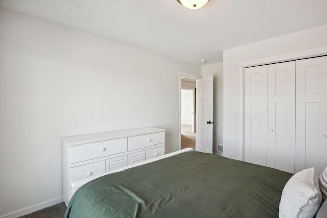 bedroom featuring a closet and carpet floors