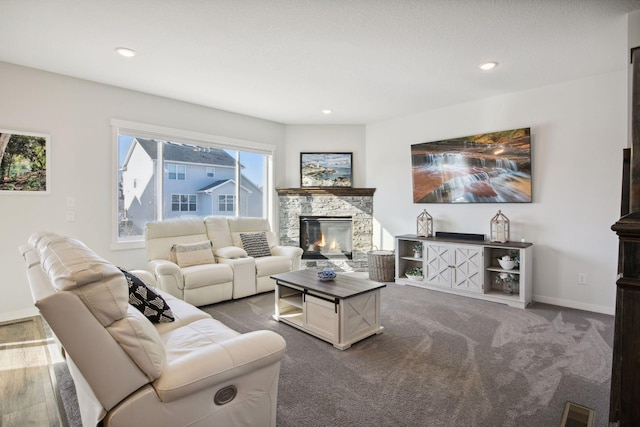 living room featuring carpet floors and a fireplace