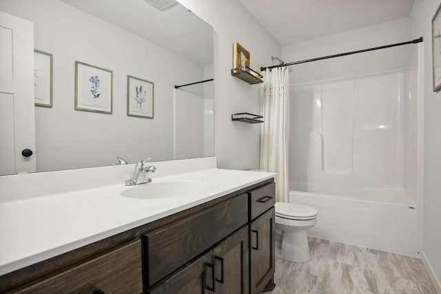 full bathroom featuring toilet, vanity, and shower / bath combo with shower curtain