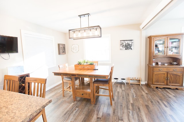 dining space featuring dark hardwood / wood-style floors