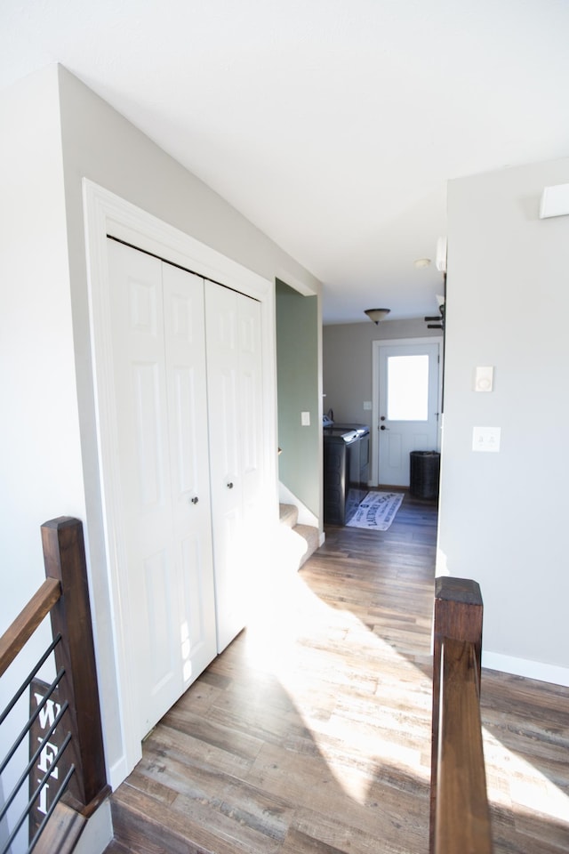 hallway with dark hardwood / wood-style flooring