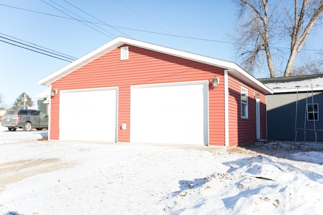 view of snow covered garage