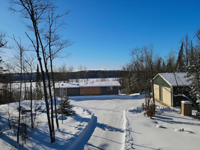 view of yard layered in snow