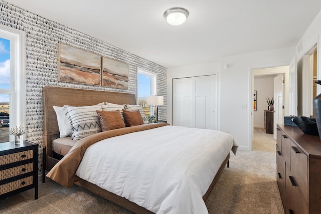 carpeted bedroom with a closet