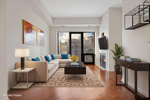 living room featuring dark wood-type flooring