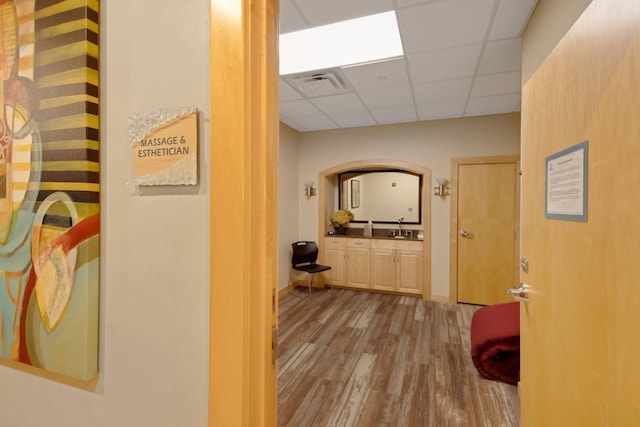 500 Grant St Unit 204, Minneapolis, MN 55404 - hallway with a paneled ceiling and wood finished floors