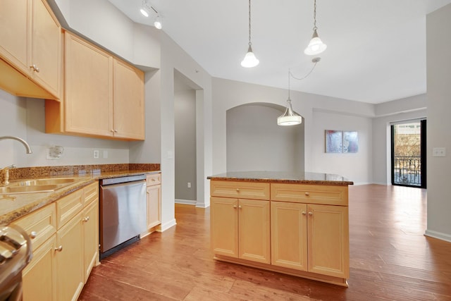 500 Grant St Unit 204, Minneapolis, MN 55404 - kitchen featuring stainless steel dishwasher, light brown cabinetry, light wood finished floors, and range