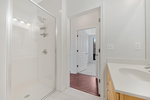 500 Grant St Unit 204, Minneapolis, MN 55404 - bathroom with a stall shower, vanity, and tile patterned flooring