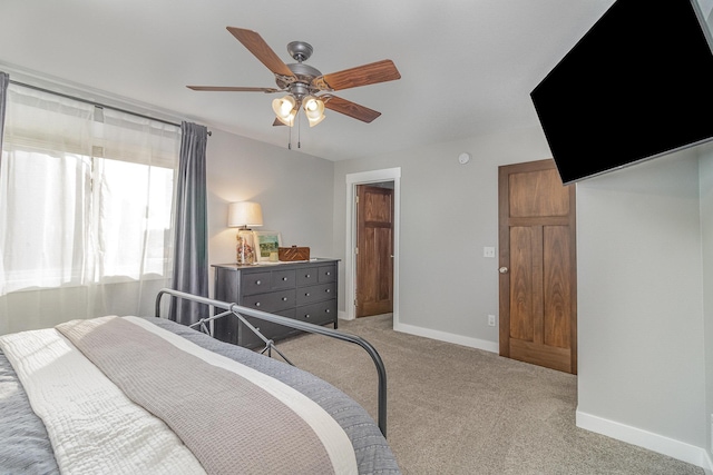 bedroom featuring ceiling fan and light colored carpet