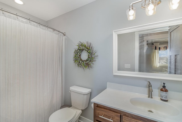 bathroom with toilet, a shower with shower curtain, and vanity