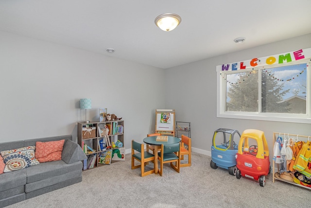 recreation room with carpet flooring