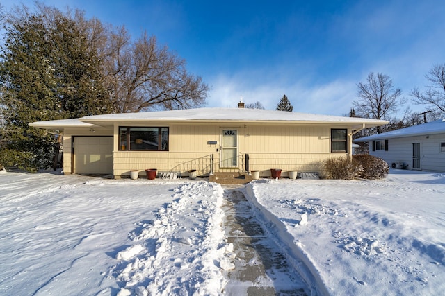 ranch-style home featuring a garage