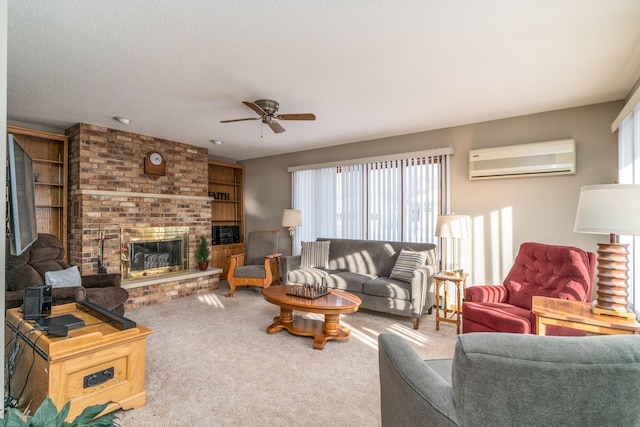 carpeted living room featuring ceiling fan, an AC wall unit, a textured ceiling, and a brick fireplace