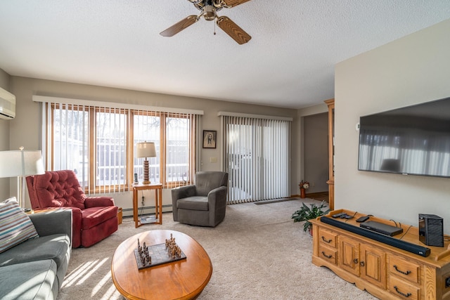 living room featuring a textured ceiling, ceiling fan, light carpet, and a baseboard heating unit