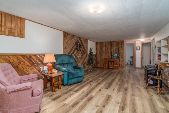 living room featuring wood walls and hardwood / wood-style floors