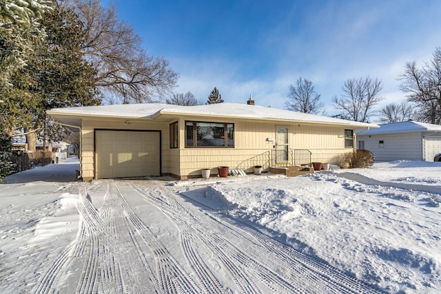 ranch-style house featuring a garage