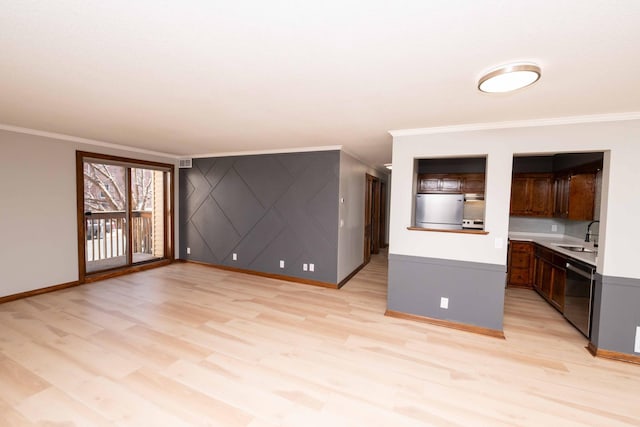 unfurnished living room with crown molding, light wood finished floors, and a sink