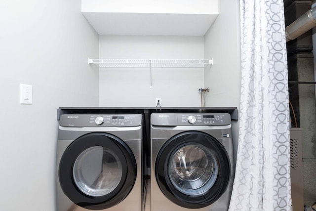 laundry area with laundry area and washer and dryer