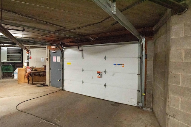 garage featuring concrete block wall