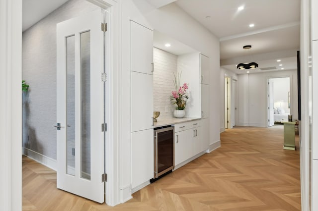 corridor featuring beverage cooler and light parquet flooring