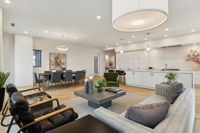 living room with sink and light parquet floors