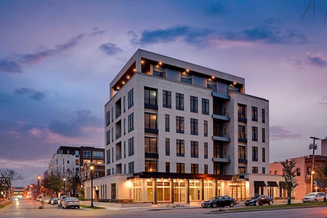 view of outdoor building at dusk