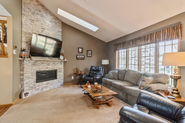 carpeted living room with vaulted ceiling and a stone fireplace