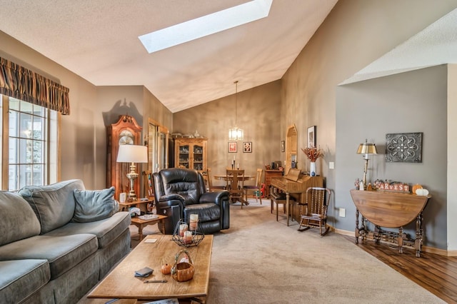 living room featuring lofted ceiling and carpet floors