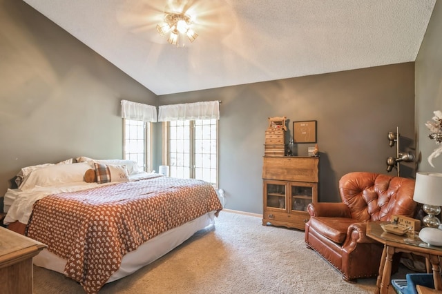 carpeted bedroom featuring ceiling fan and lofted ceiling