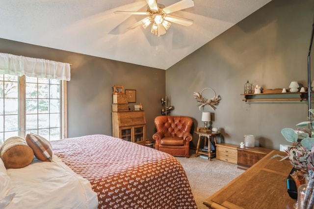 carpeted bedroom featuring vaulted ceiling and ceiling fan